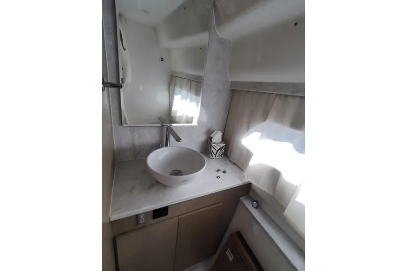 Me Yacht Photos Pics Modern bathroom interior of 2021 Regal 42 Fly yacht with sleek sink and mirror.