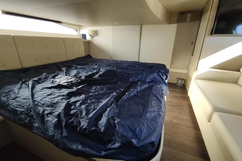 Me Yacht Photos Pics Luxurious interior of 2021 Regal 42 Fly yacht with spacious bed and modern design.