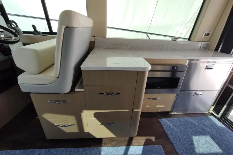 Me Yacht Photos Pics Interior of 2021 Regal 42 Fly yacht with modern kitchen and seating area.