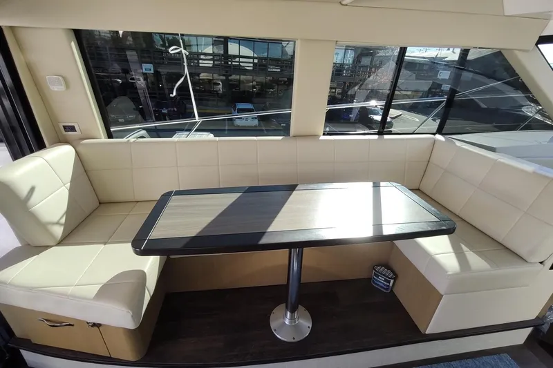 Me Yacht Photos Pics Luxurious interior seating area on 2021 Regal 42 Fly yacht with large windows.