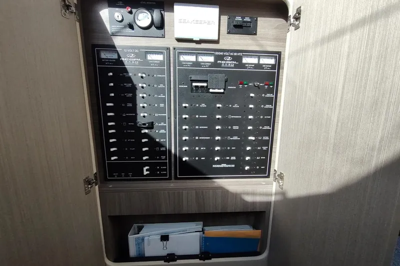 Me Yacht Photos Pics Electrical control panel on a 2021 Regal 42 Fly yacht, featuring various switches and gauges.