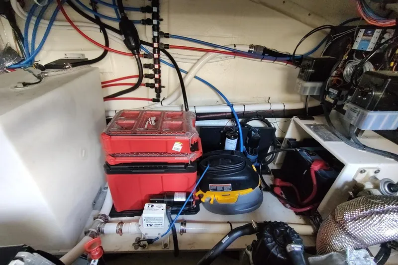 Me Yacht Photos Pics Engine room of 2021 Regal 42 Fly yacht with tools and wiring.