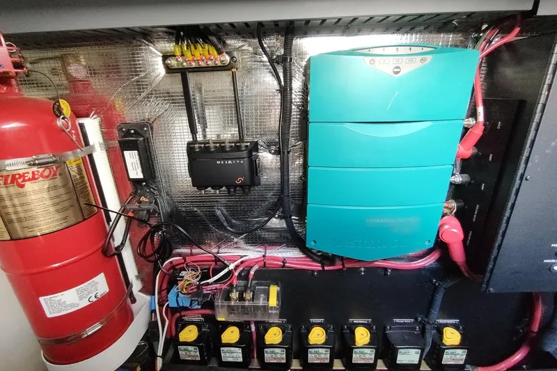 Me Yacht Photos Pics Electrical panel of 2021 Regal 42 Fly yacht with fire extinguisher and wiring components.