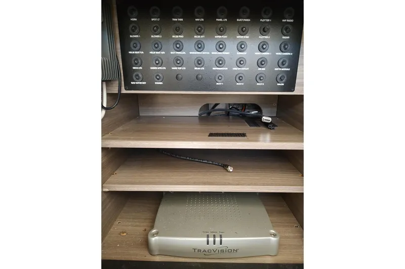 Me Yacht Photos Pics Control panel and TracVision system in 2021 Regal 42 Fly yacht interior.