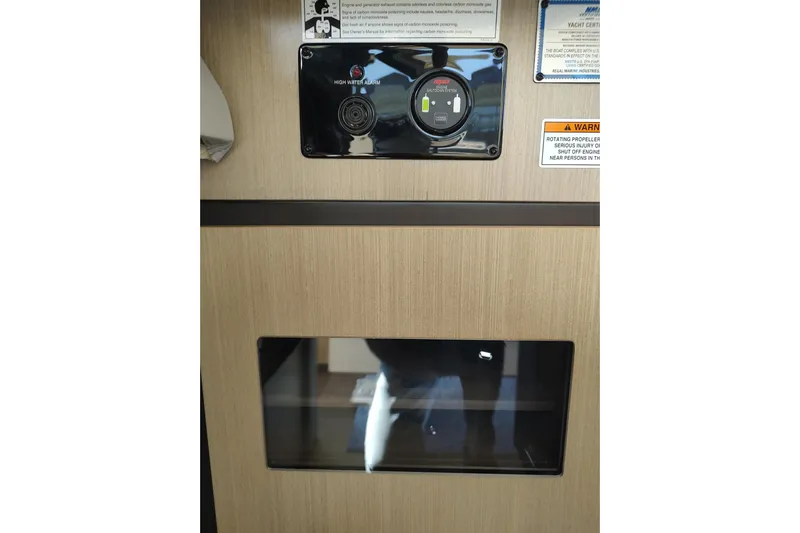 Me Yacht Photos Pics Control panel and warning labels on 2021 Regal 42 Fly yacht interior.