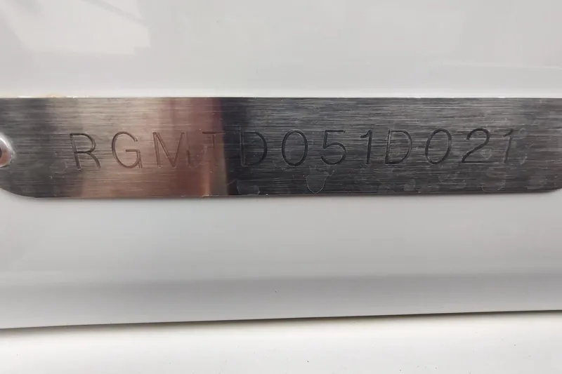 Me Yacht Photos Pics Metallic identification plate on a 2021 Regal 42 Fly boat, displaying serial number.