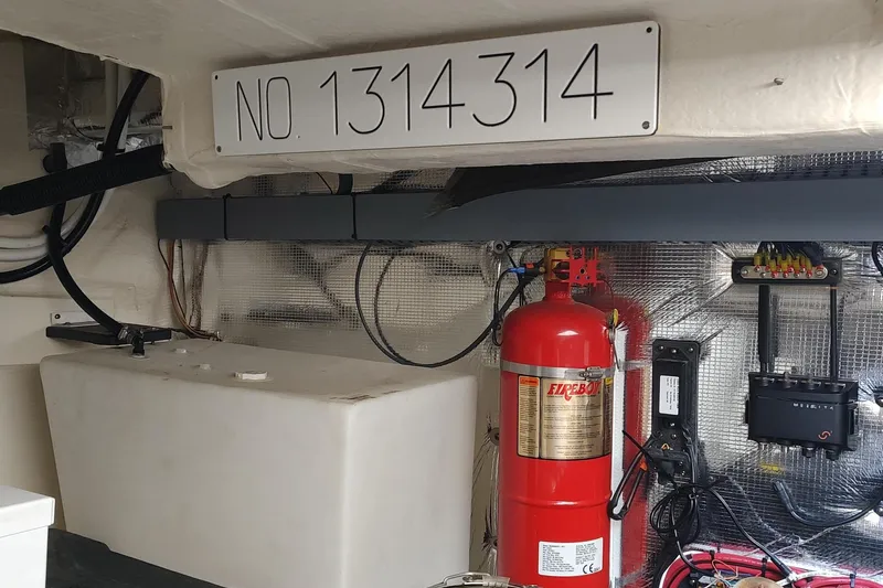 Me Yacht Photos Pics Engine room of 2021 Regal 42 Fly with fire extinguisher and wiring.