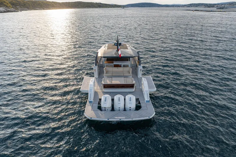  Yacht Photos Pics 2024 Wiszniewski Yachts W43 on serene water at sunset, rear view.