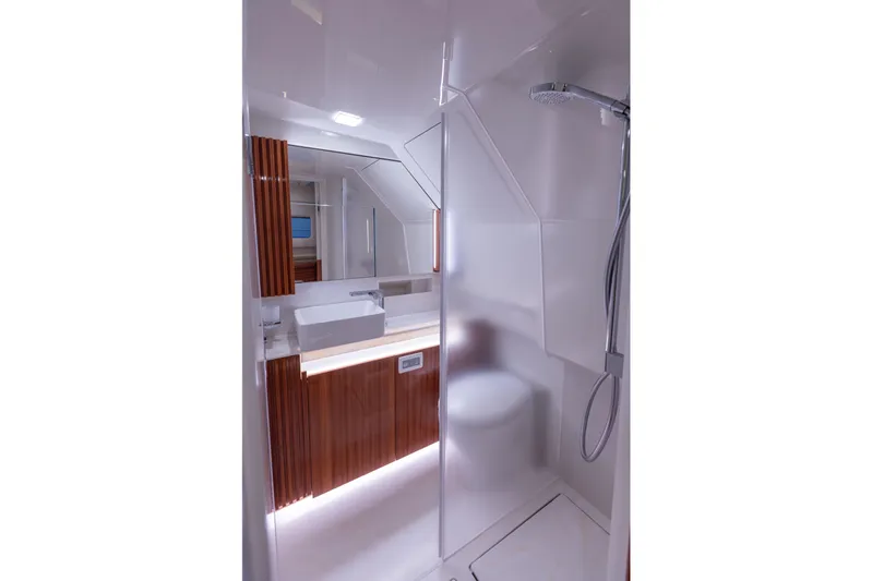  Yacht Photos Pics Luxurious bathroom in 2024 Wiszniewski Yachts W43, featuring modern shower and sleek design.