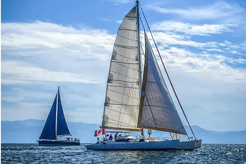 Koa E Kea Yacht Photos Pics Sailboats on open sea under clear blue sky, featuring Custom Pinta Exception 53, 1986 model.