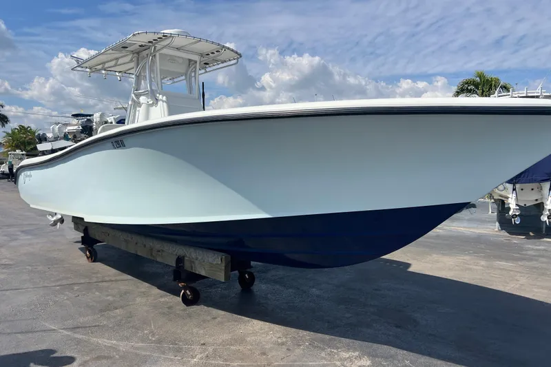  Yacht Photos Pics 2019 Yellowfin 29 Offshore boat on display under a clear blue sky.