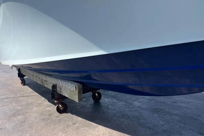  Yacht Photos Pics 2019 Yellowfin 29 Offshore boat hull on a wheeled support.