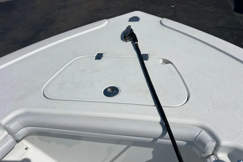  Yacht Photos Pics 2019 Yellowfin 29 Offshore boat deck with storage compartment and anchor line.