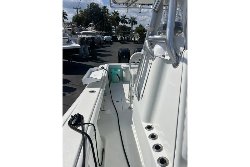  Yacht Photos Pics 2019 Yellowfin 29 Offshore boat deck with fishing rod holders and seating.