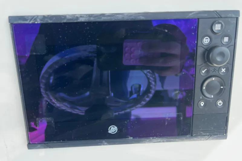  Yacht Photos Pics Control panel of a 2019 Yellowfin 29 Offshore boat with reflection.