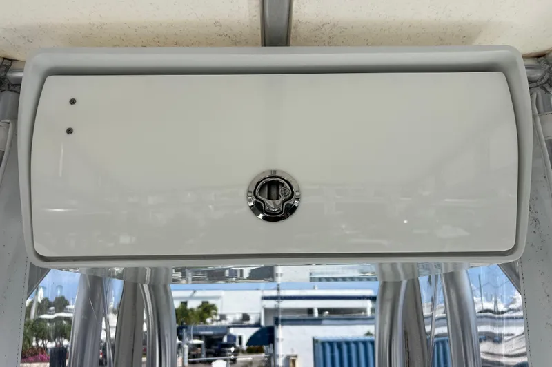  Yacht Photos Pics 2019 Yellowfin 29 Offshore boat storage compartment with latch, viewed from below.