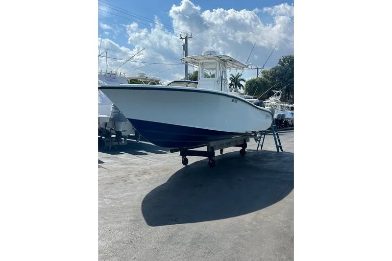  Yacht Photos Pics 2019 Yellowfin 29 Offshore boat on trailer under a sunny sky.
