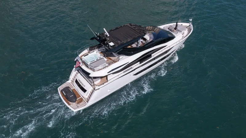 Hideout Yacht Photos Pics 2025 Sunseeker 88 Yacht cruising on open water, aerial view.