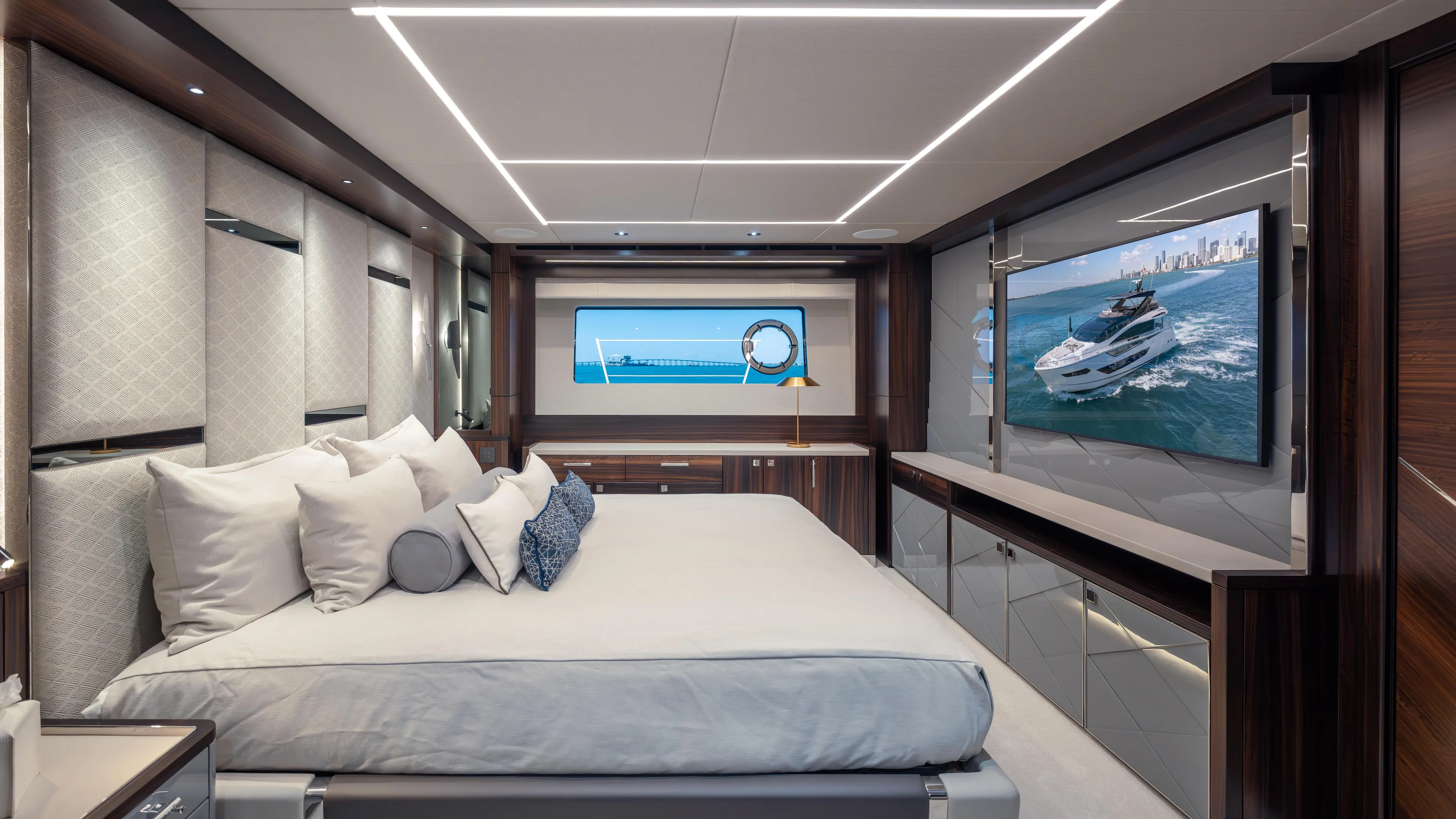 Hideout Yacht Photos Pics Luxurious bedroom interior of 2025 Sunseeker 88 Yacht with modern design and elegant furnishings.