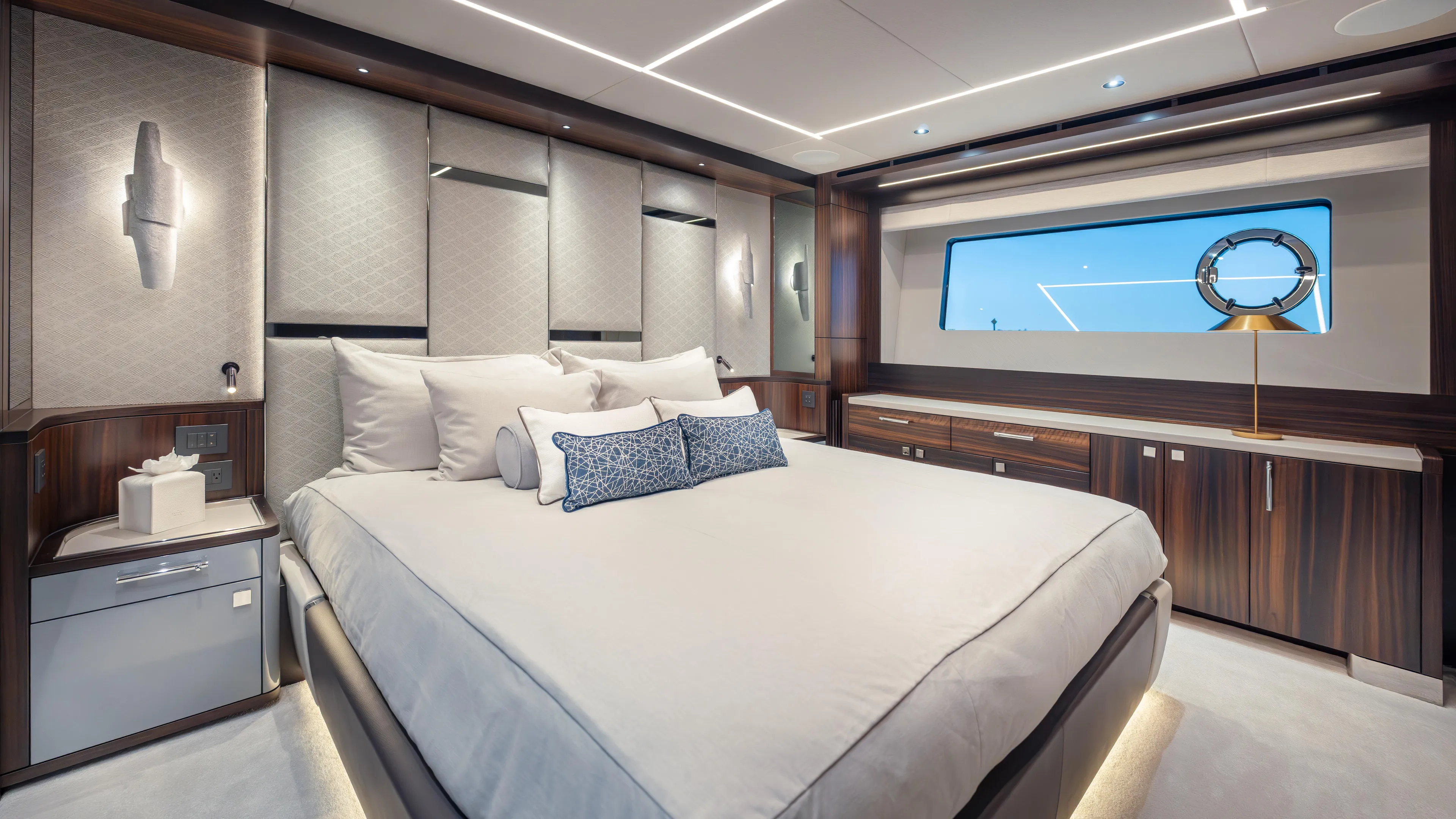 Hideout Yacht Photos Pics Luxurious bedroom interior of 2025 Sunseeker 88 Yacht with modern design and elegant furnishings.