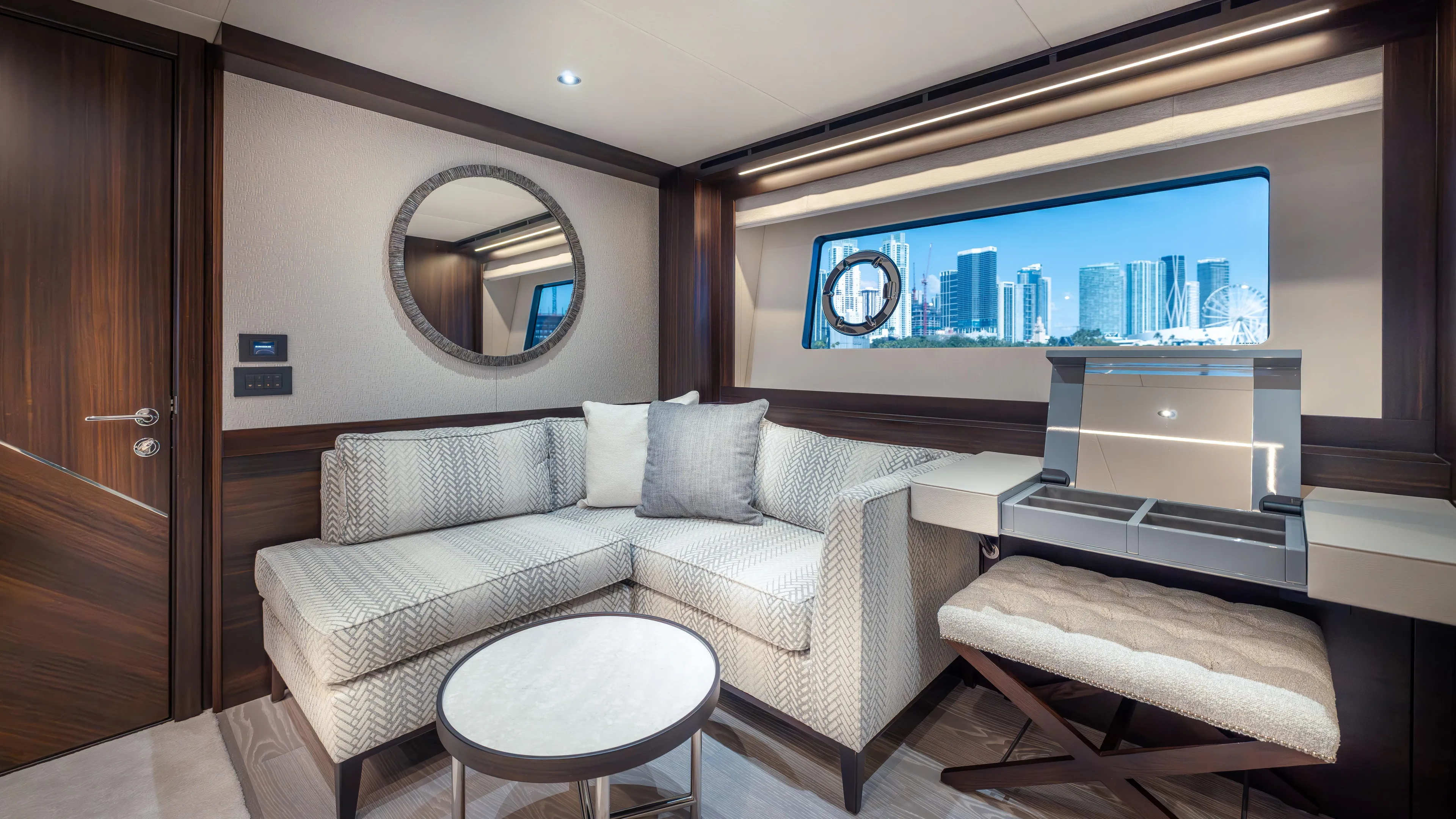 Hideout Yacht Photos Pics Luxurious interior of 2025 Sunseeker 88 Yacht with modern furnishings and cityscape view.