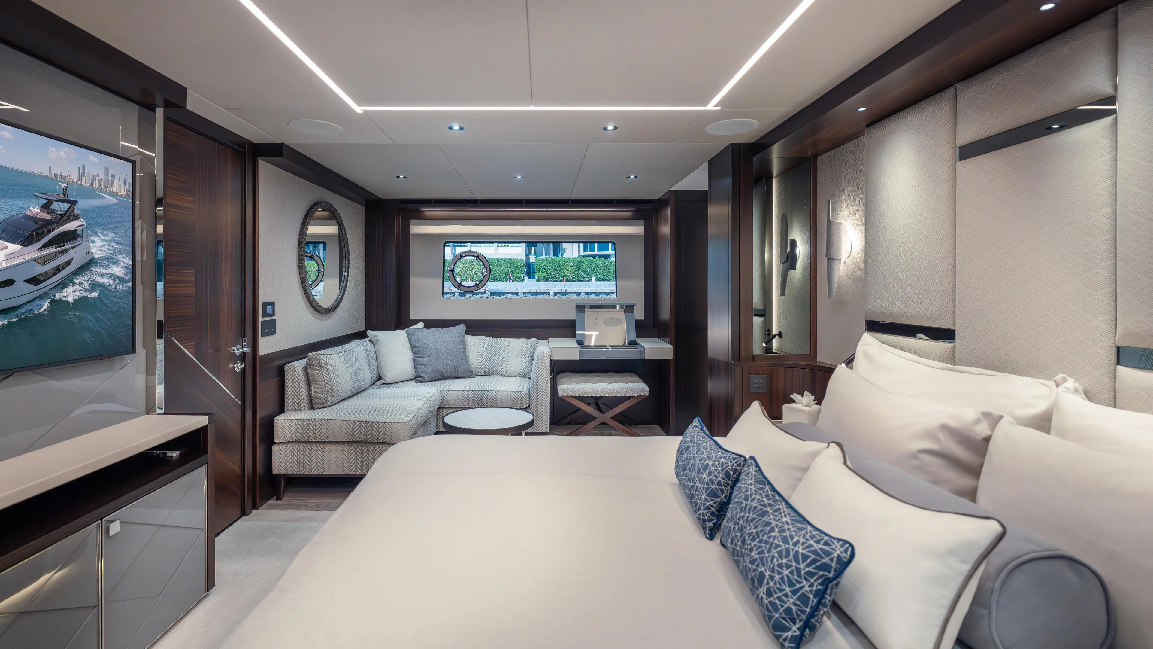 Hideout Yacht Photos Pics Luxurious interior of 2025 Sunseeker 88 Yacht with elegant bedroom and seating area.