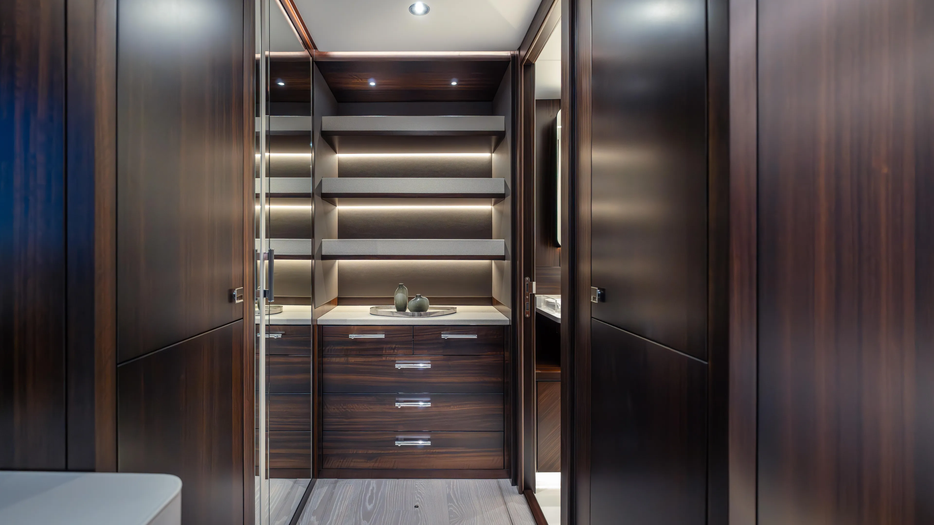 Hideout Yacht Photos Pics Luxurious interior of 2025 Sunseeker 88 Yacht with elegant wood cabinetry and modern lighting.