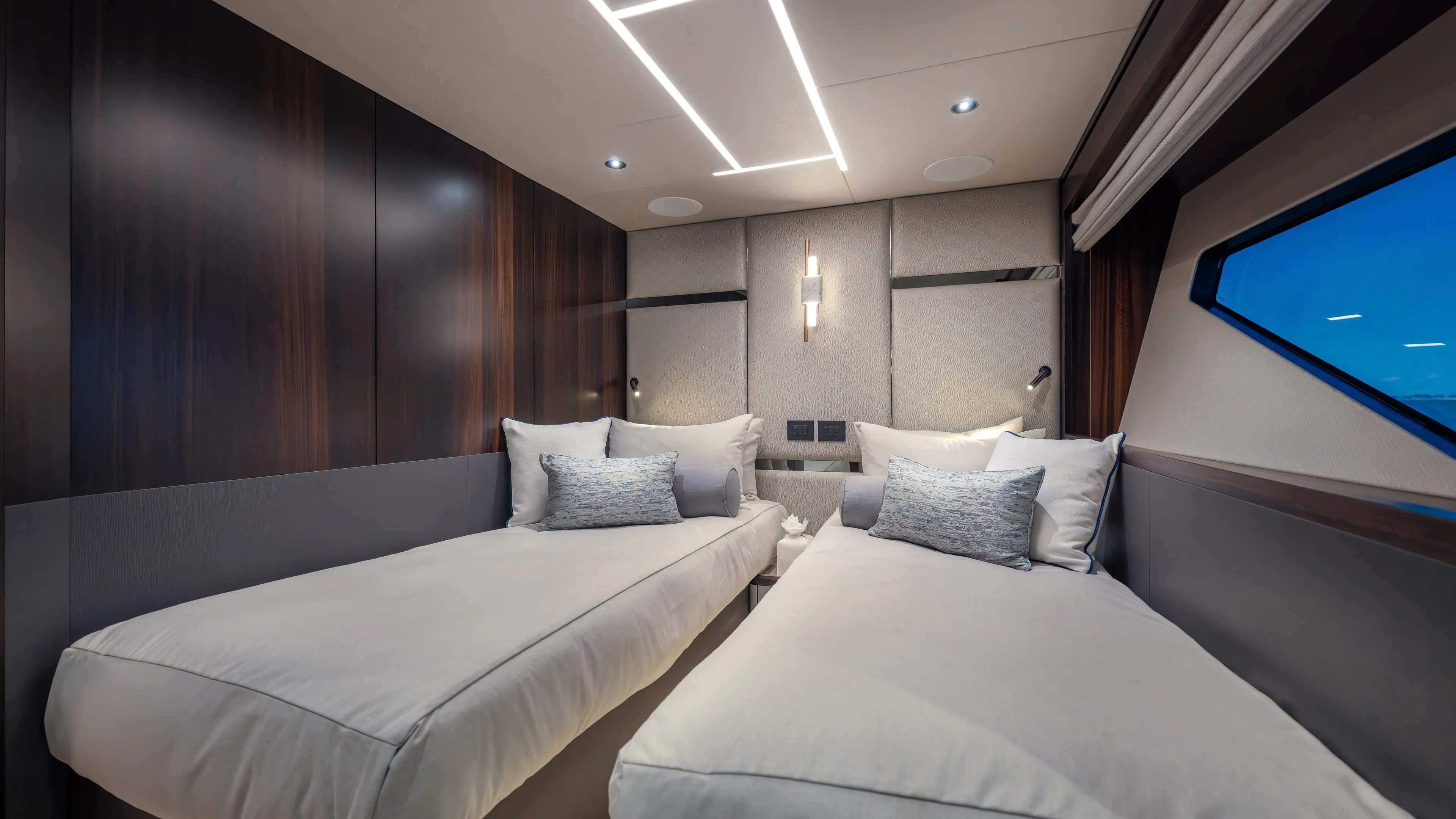 Hideout Yacht Photos Pics Luxurious twin bedroom in 2025 Sunseeker 88 Yacht with modern design and ambient lighting.