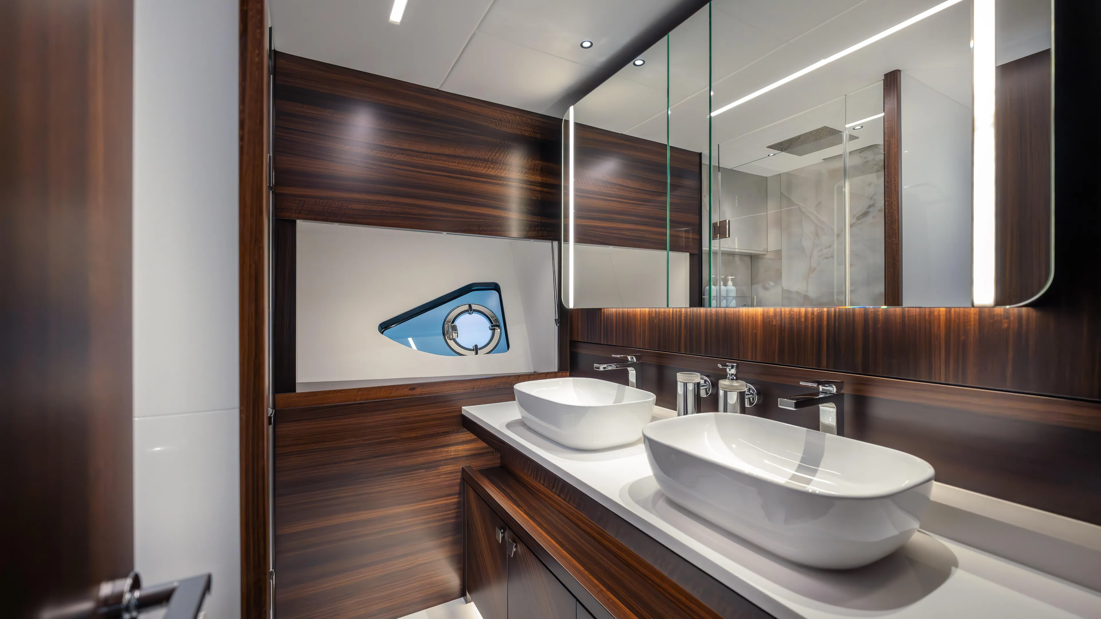 Hideout Yacht Photos Pics Luxurious bathroom interior of 2025 Sunseeker 88 Yacht with dual sinks and modern design.