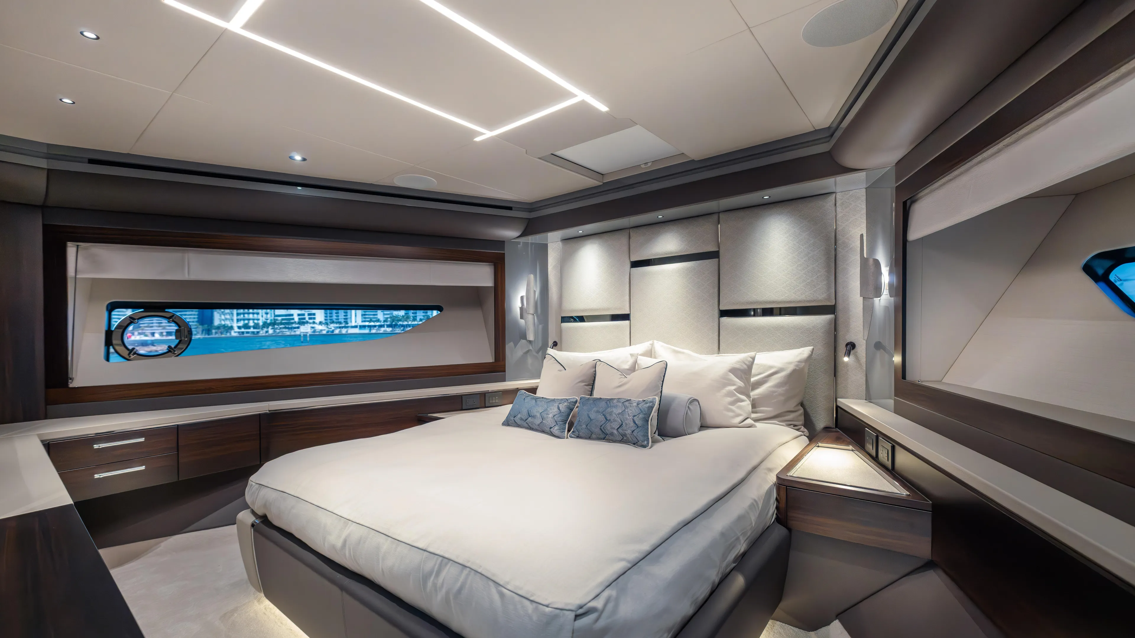Hideout Yacht Photos Pics Luxurious bedroom interior of 2025 Sunseeker 88 Yacht, featuring modern design and elegant lighting.