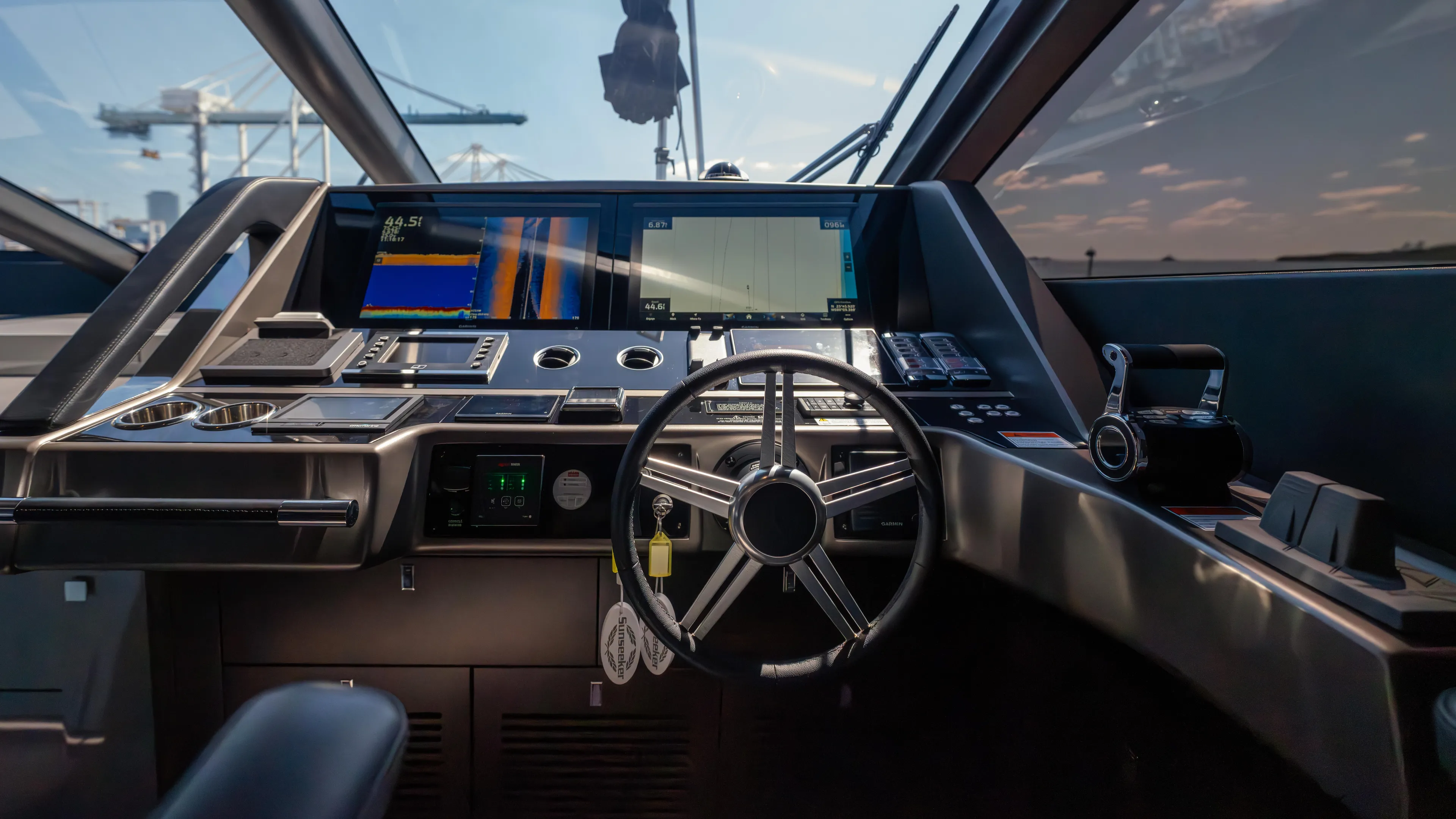 Hideout Yacht Photos Pics Cockpit of 2025 Sunseeker 88 Yacht with advanced navigation systems and sleek design.