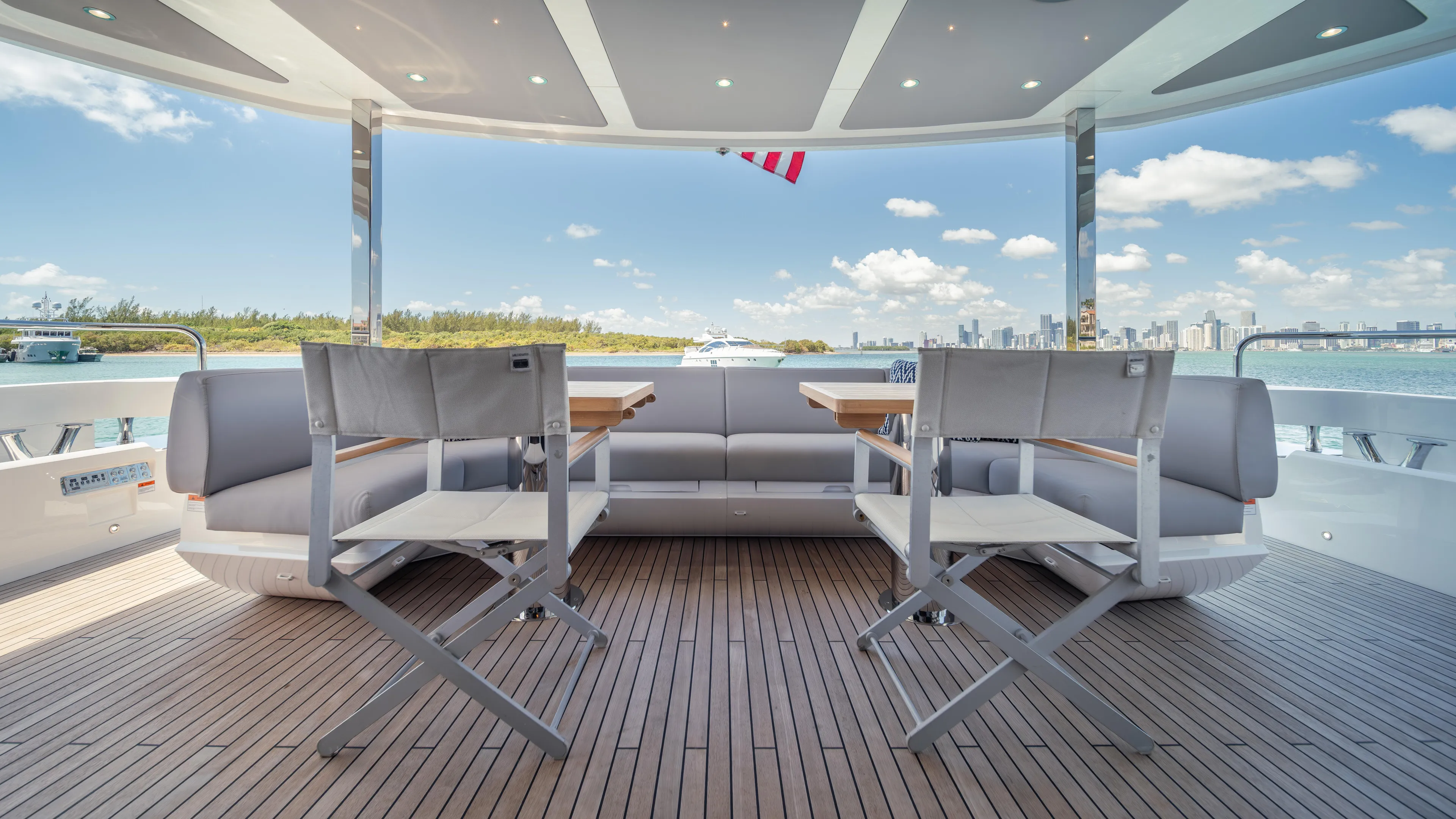 Hideout Yacht Photos Pics Luxurious Sunseeker 88 Yacht 2025 deck with seating, ocean view, and modern design.