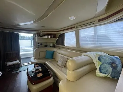 Yacht Photos Pics Luxurious interior of 2003 Sea Ray 480 Sedan Bridge yacht with plush seating.