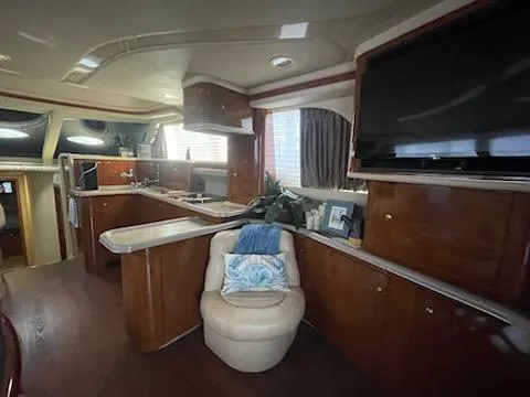  Yacht Photos Pics Luxurious interior of 2003 Sea Ray 480 Sedan Bridge yacht with modern amenities.