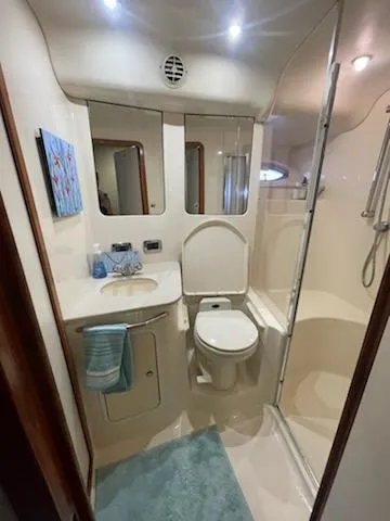  Yacht Photos Pics Luxurious bathroom in 2003 Sea Ray 480 Sedan Bridge yacht with shower and vanity.
