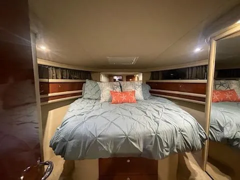  Yacht Photos Pics Luxurious bedroom interior of 2003 Sea Ray 480 Sedan Bridge yacht.