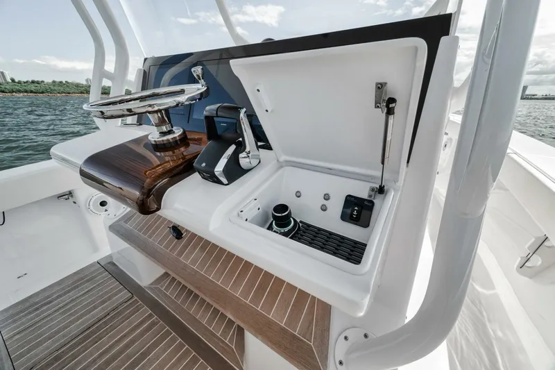  Yacht Photos Pics 2023 Jupiter 40 boat helm station with steering wheel and controls.