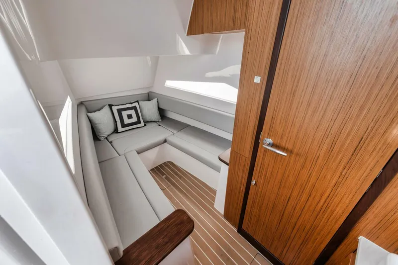  Yacht Photos Pics 2023 Jupiter 40 yacht interior with modern seating and wooden accents.
