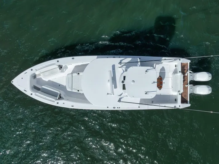  Yacht Photos Pics Aerial view of 2023 Jupiter 40 boat on water, showcasing sleek design and twin engines.