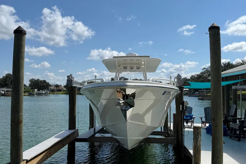  Yacht Photos Pics 2005 Marlago 35 boat docked on a sunny day with blue sky and clouds.