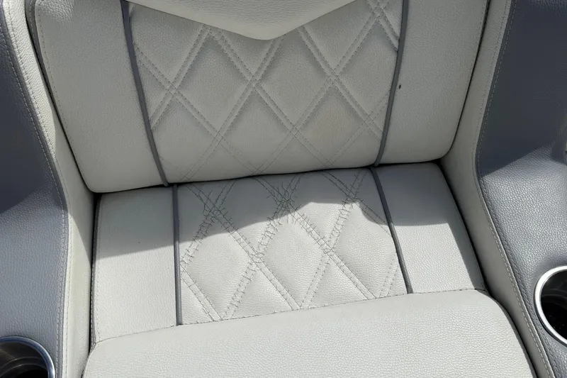  Yacht Photos Pics Quilted leather seat of 2005 Marlago 35 boat with cup holders.