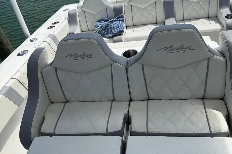  Yacht Photos Pics Luxury seating on a 2005 Marlago 35 boat with diamond-stitched upholstery.