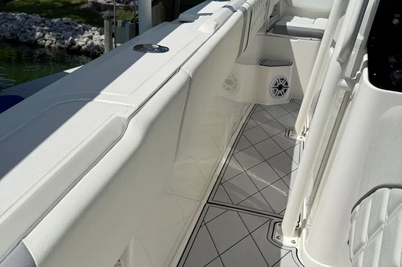  Yacht Photos Pics Interior view of a 2005 Marlago 35 boat, featuring white seating and sleek flooring.