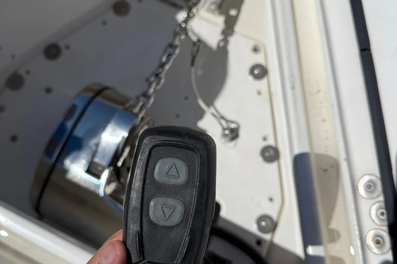  Yacht Photos Pics Remote control for anchor winch on 2005 Marlago 35 boat, with chain and winch visible.