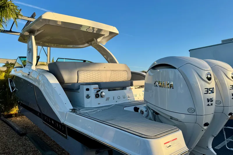  Yacht Photos Pics 2026 Four Winns H33 OB boat with dual Yamaha 350 V6 engines, sleek design.
