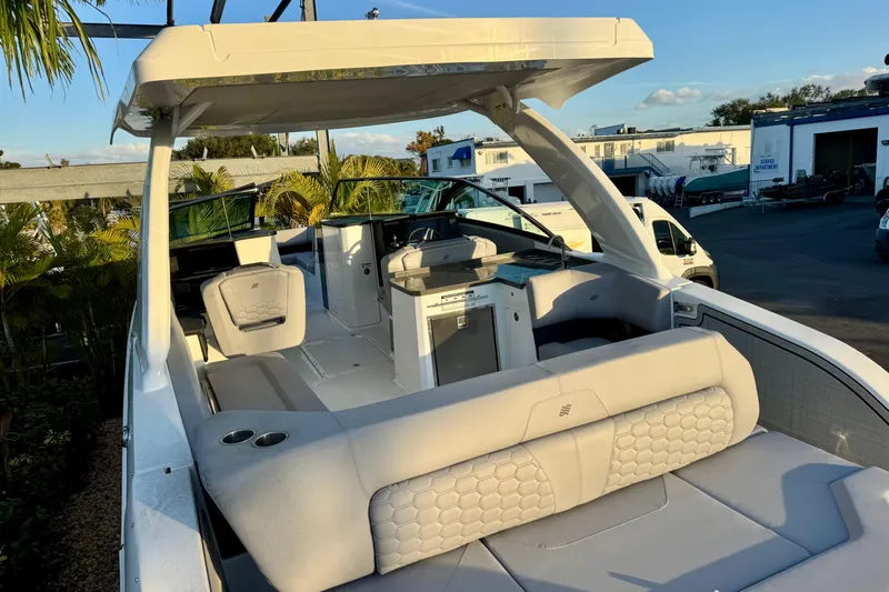  Yacht Photos Pics 2026 Four Winns H33 OB boat interior with modern seating and sleek design.