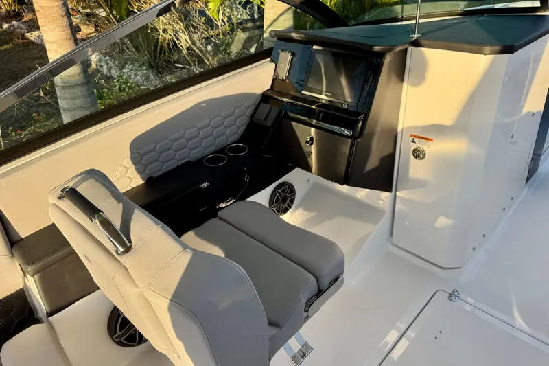  Yacht Photos Pics Interior of 2026 Four Winns H33 OB boat with modern seating and dashboard.