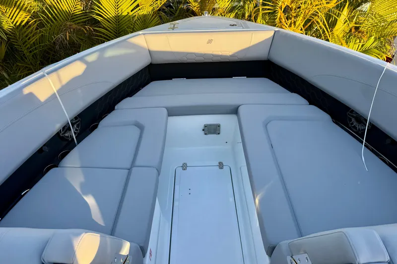  Yacht Photos Pics 2026 Four Winns H33 OB boat interior with cushioned seating and sleek design.