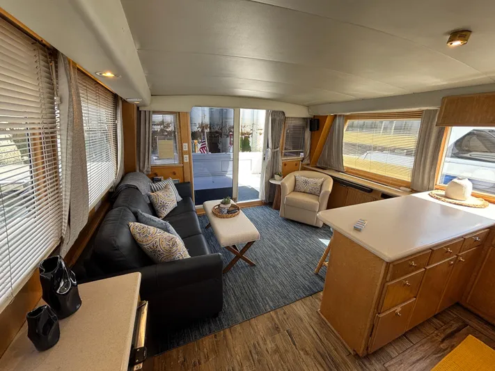 Orca Belle Yacht Photos Pics Interior of 2000 Navigator 5300 yacht with cozy seating and modern kitchen area.