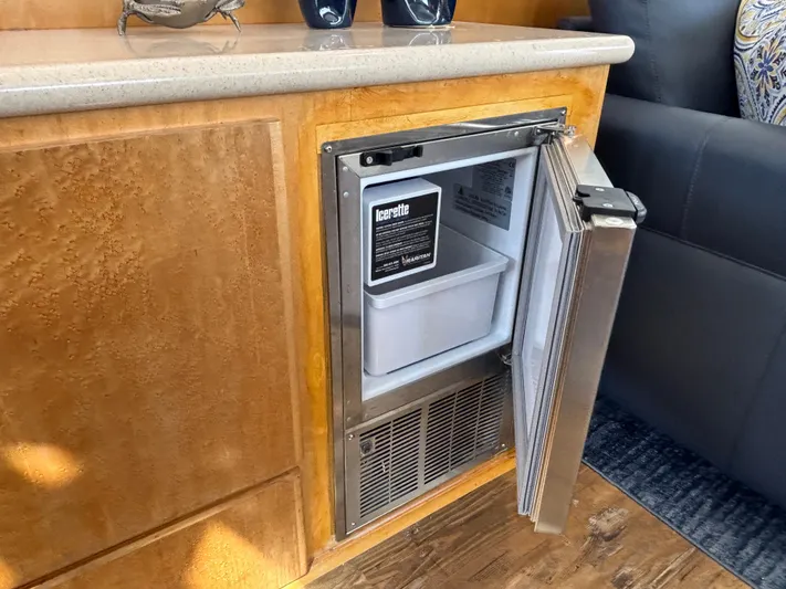 Orca Belle Yacht Photos Pics Small built-in refrigerator in a 2000 Navigator 5300 yacht interior.